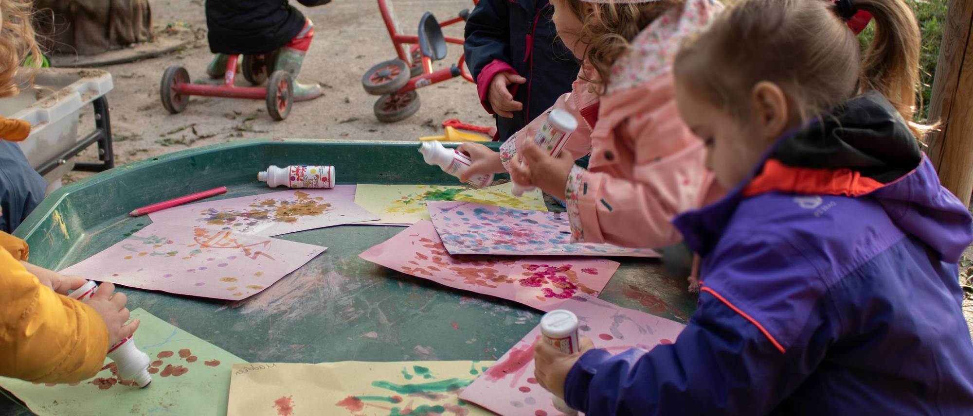 children-painting-outside